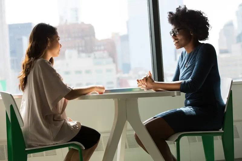 Compassionate psychiatrist speaking with anxiety patient